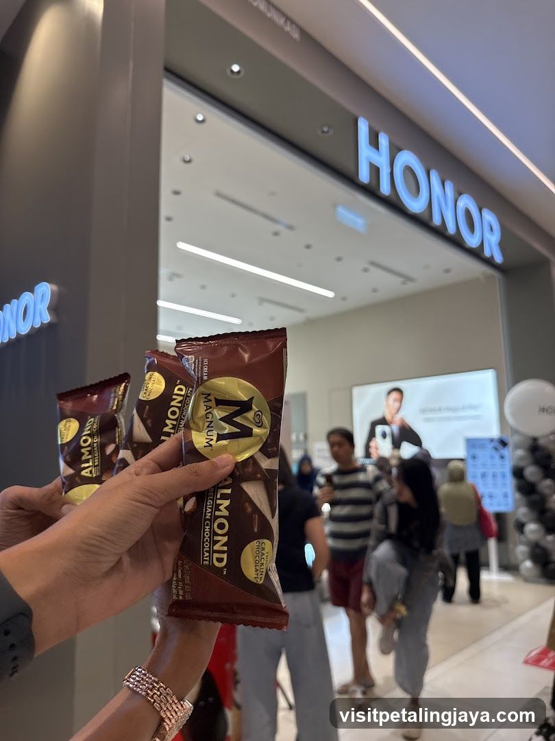 Hand holding snacks in front of store entrance
