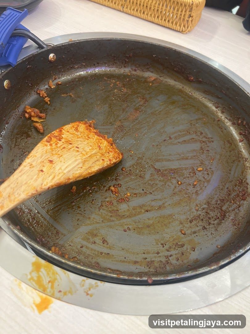 Empty Pan with Wooden Spatula