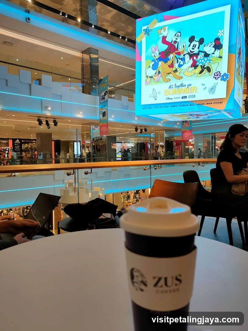 Interior of a shopping mall with café seating