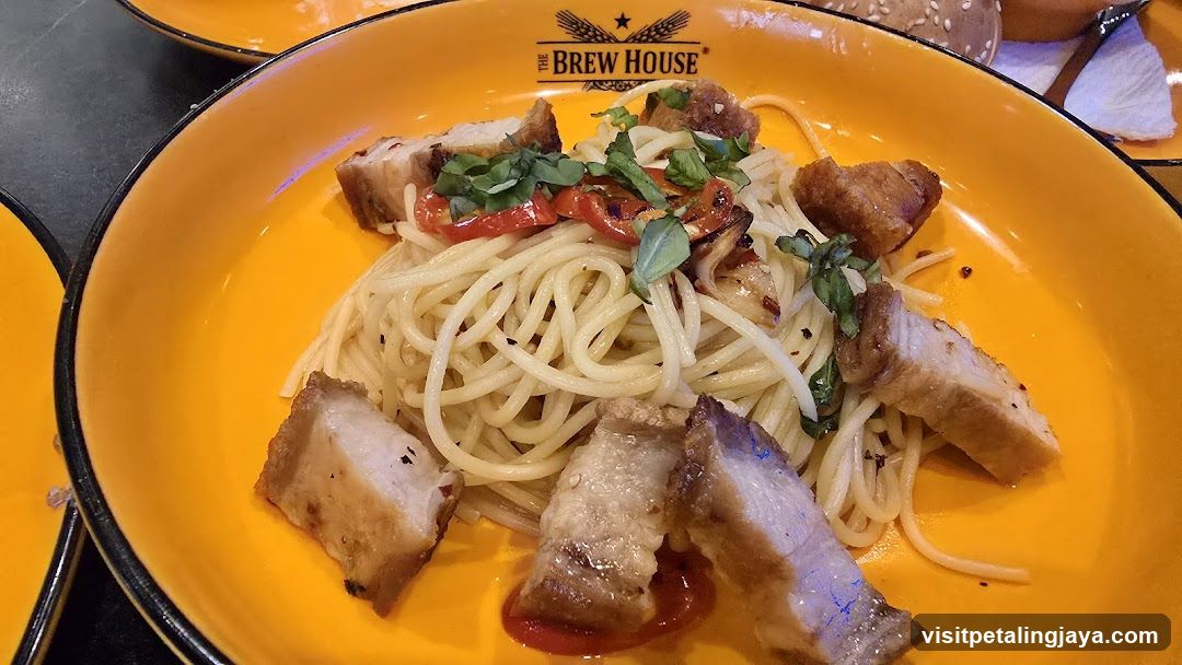 Spaghetti dish with pork and herbs