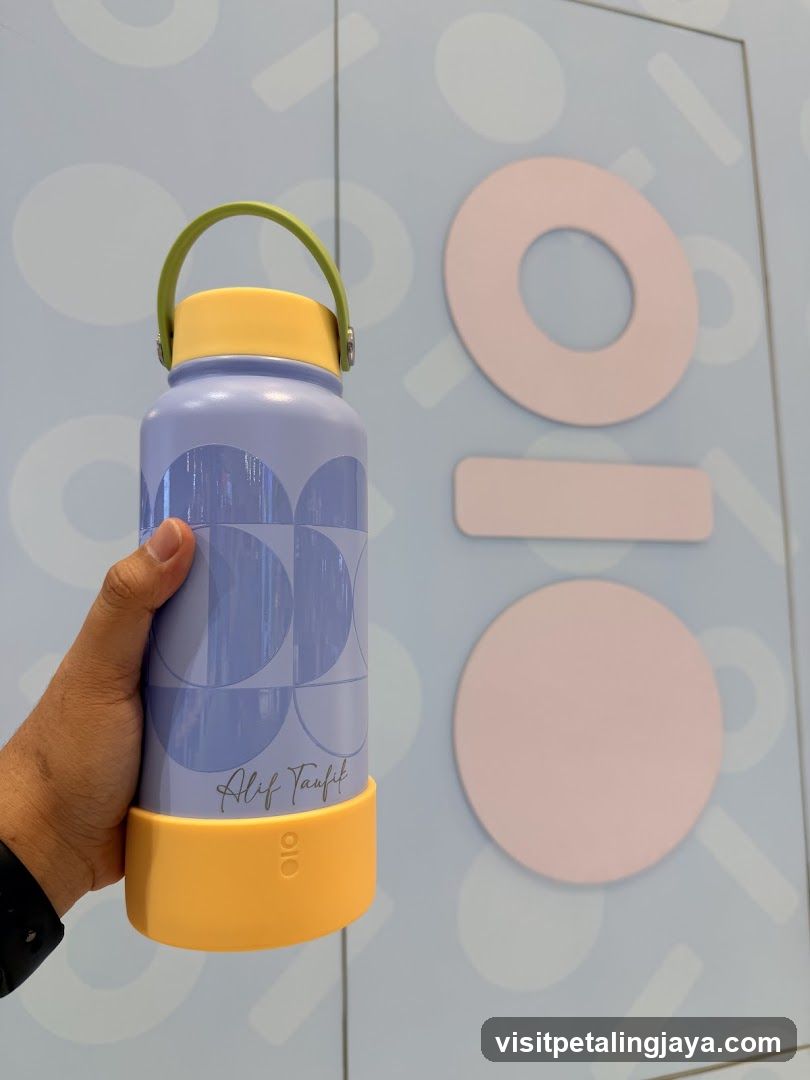 Hand holding water bottle