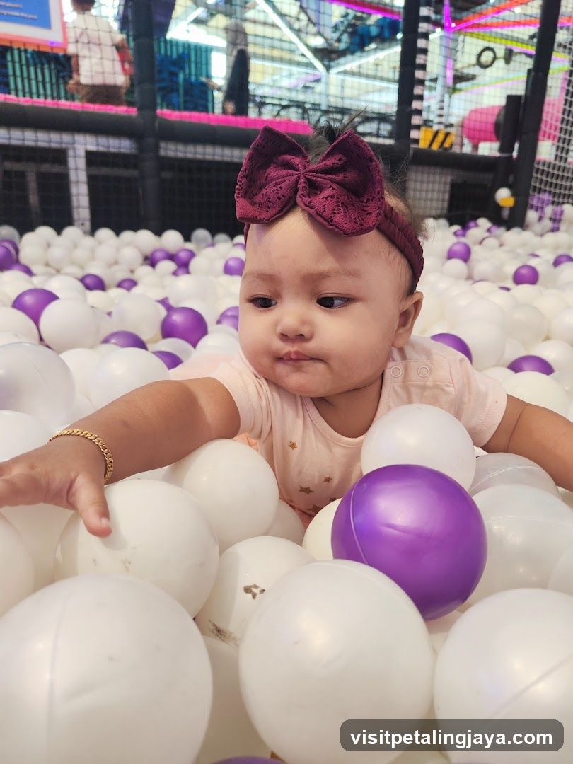 Baby in ball pit