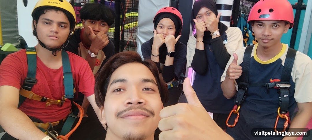 Group selfie at indoor activity center