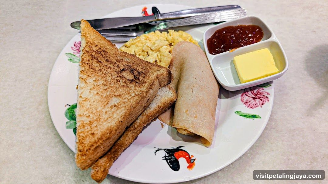 Breakfast Plate with Toast, Scrambled Eggs, and Rolls
