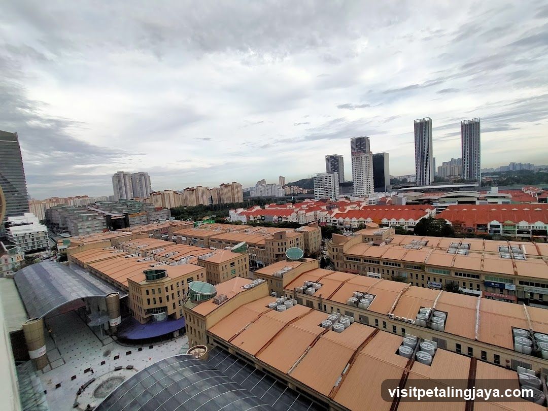 Cityscape with red-tiled roofs and high-rise buildings