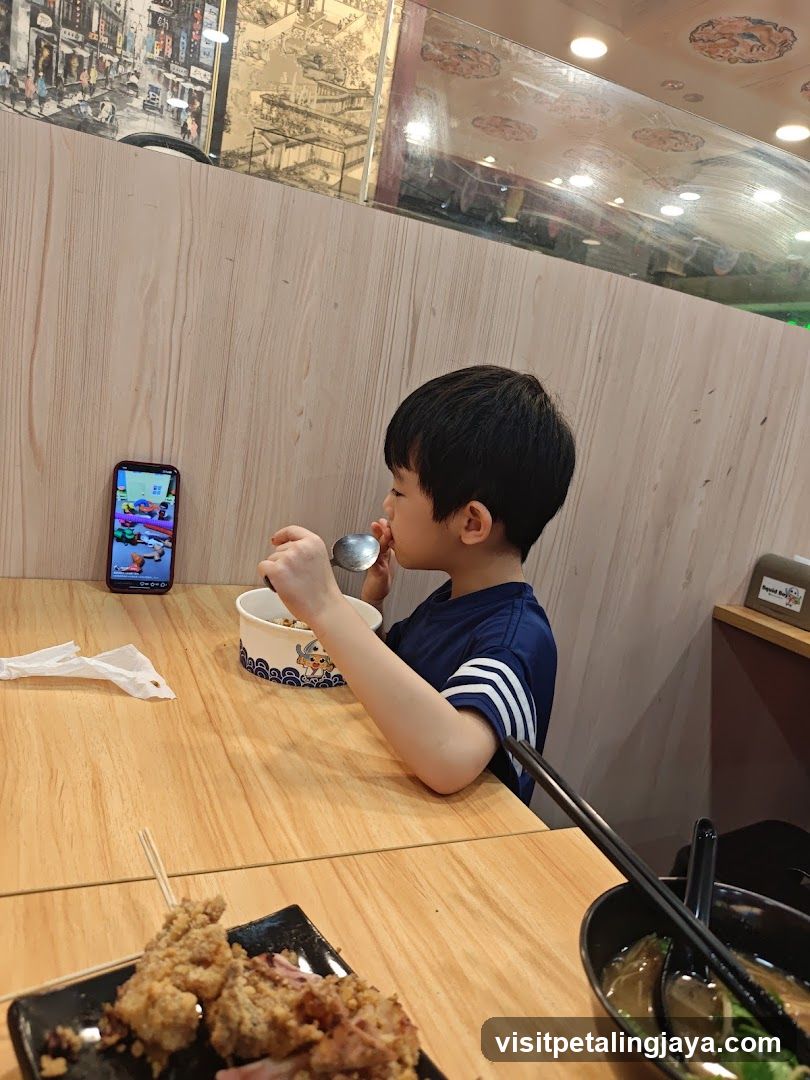 Child Eating at Restaurant