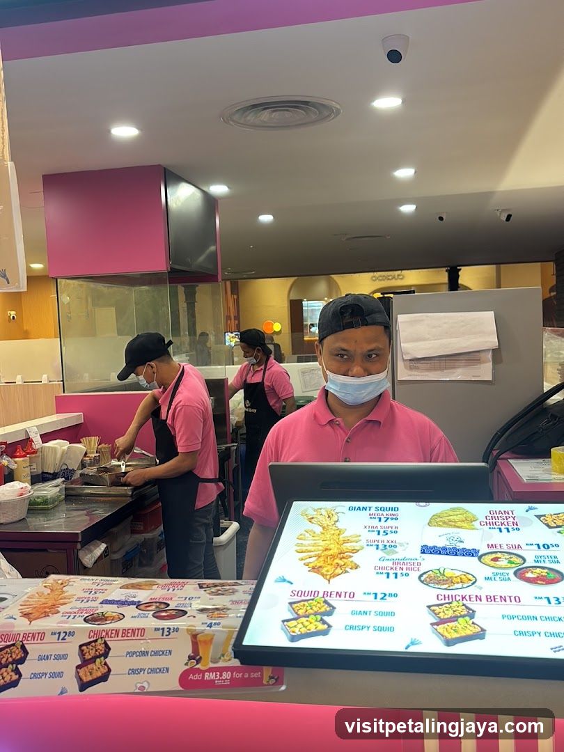 Food Stall Interior with Staff and Menu Display