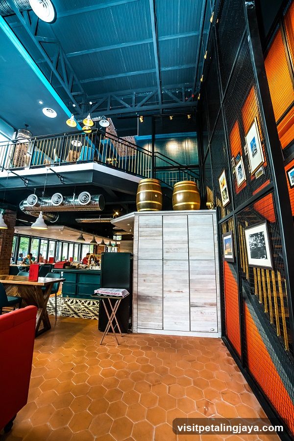 Industrial Interior with Barrels and Framed Art