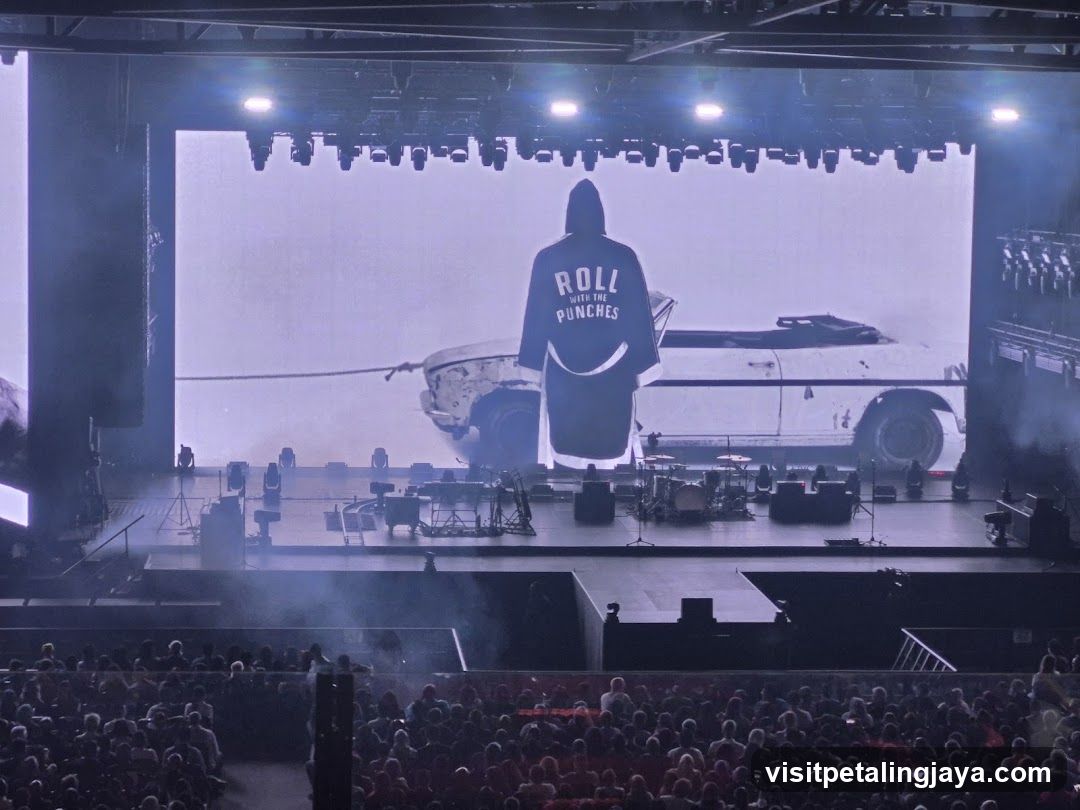 Concert Stage with Hooded Figure and Car