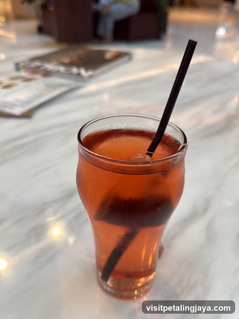 Red Drink with Straw on Marble Table