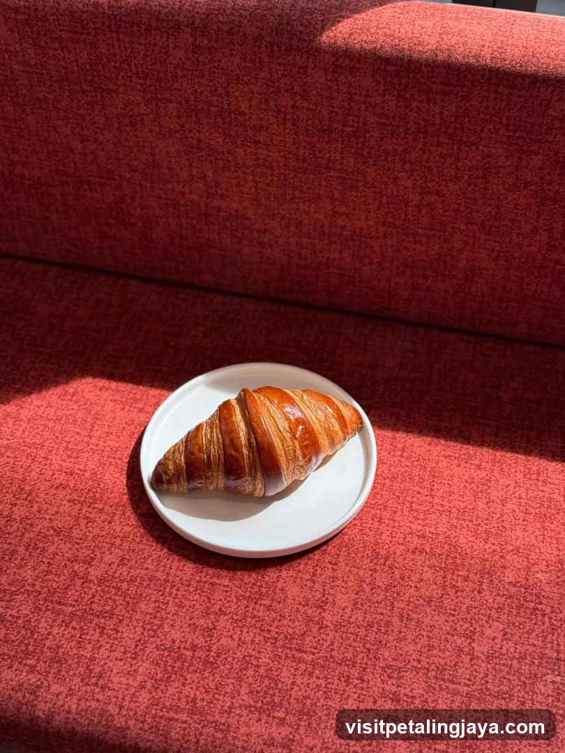 Croissant on Red Sofa