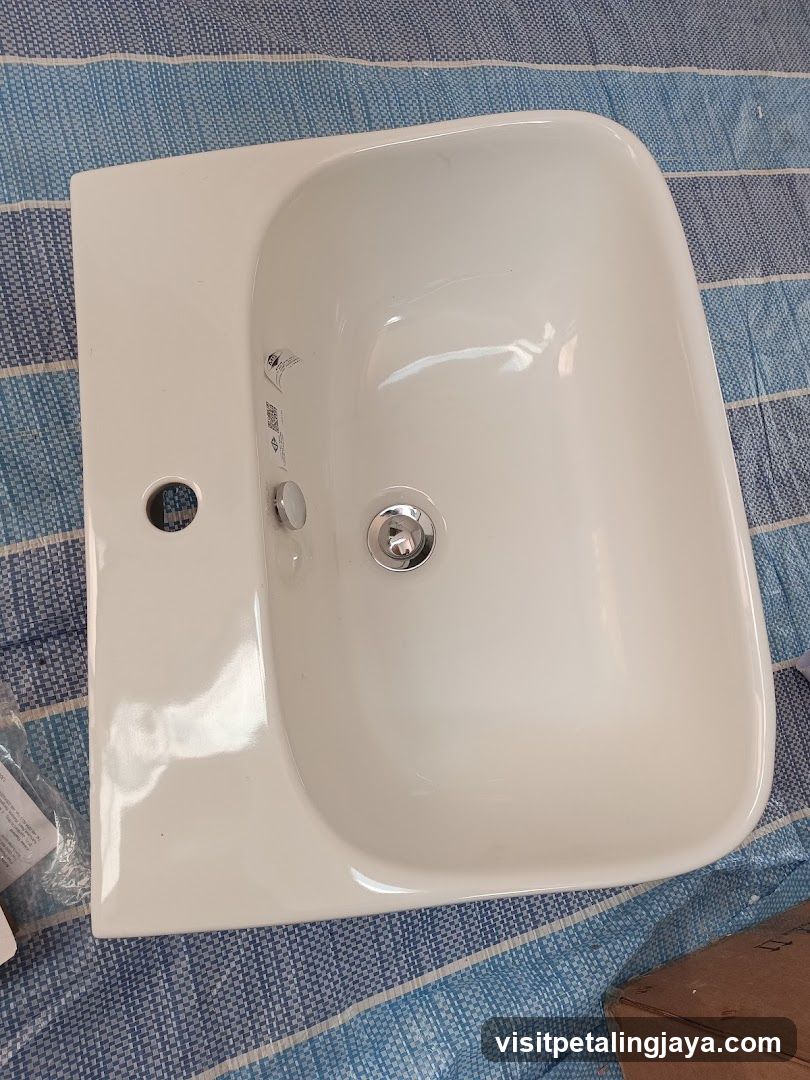 White Ceramic Sink on Blue Striped Fabric