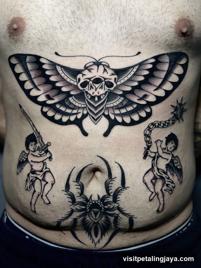 Moth and Cherub Tattoo on Chest