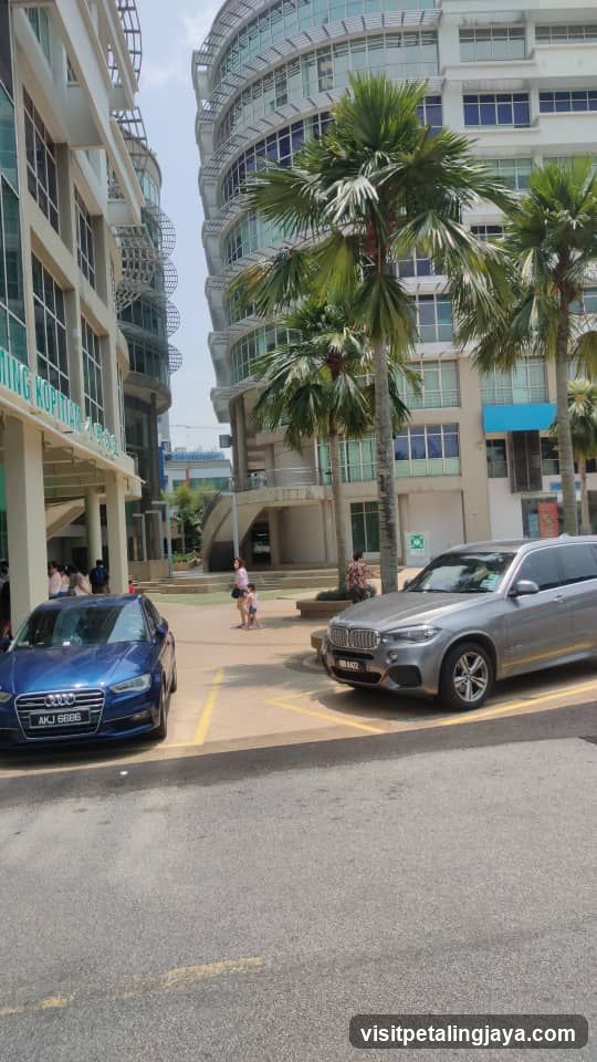 Parking Area with Cars and Buildings