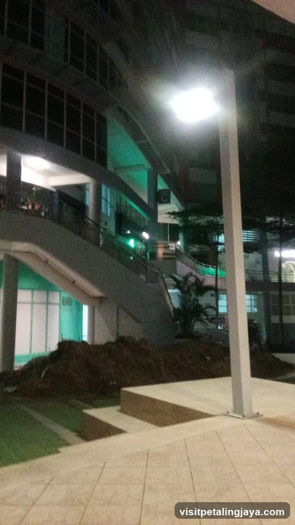 Night view of building exterior with construction area