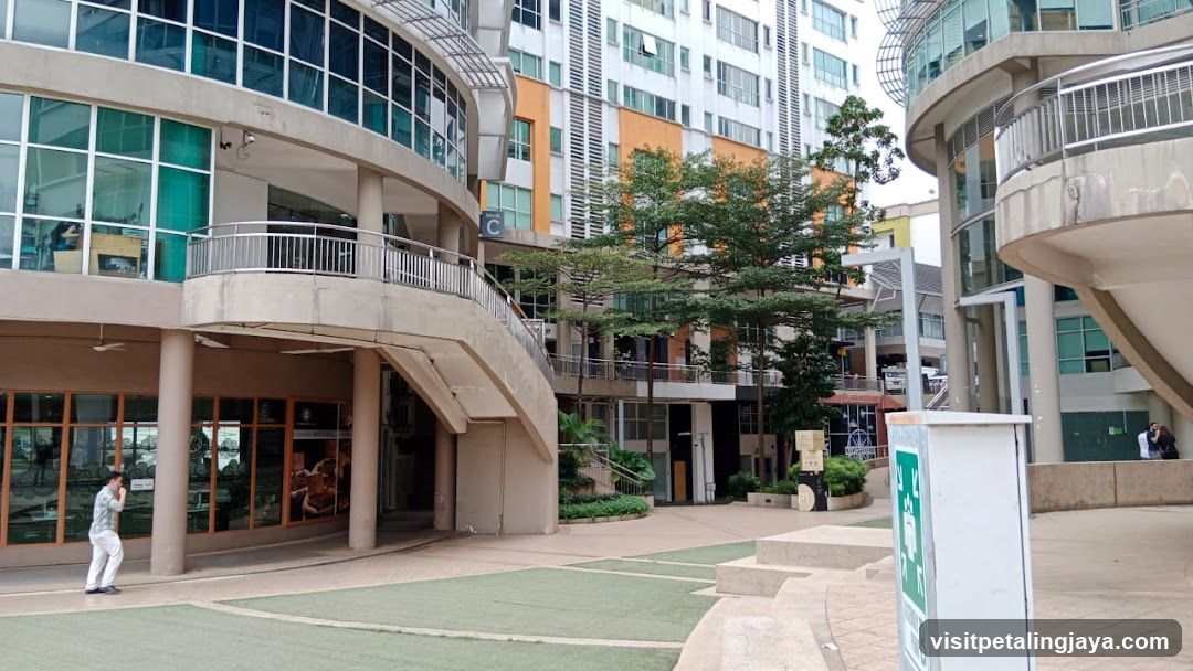 Modern Building Exterior with Walkway and Greenery