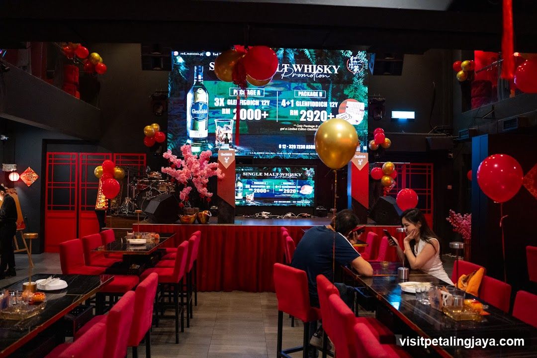 Bar Interior with Promotional Screen