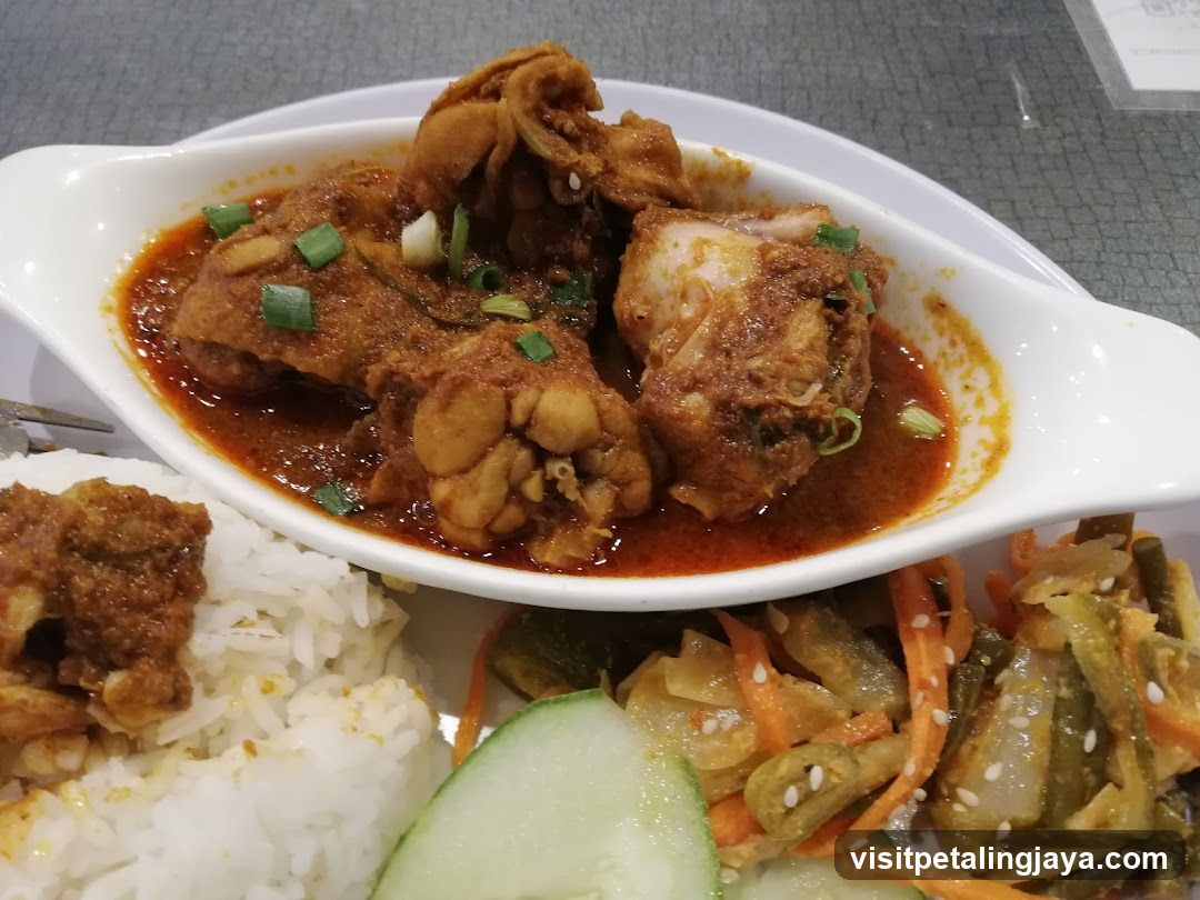 Curry Dish with Rice and Side Vegetables