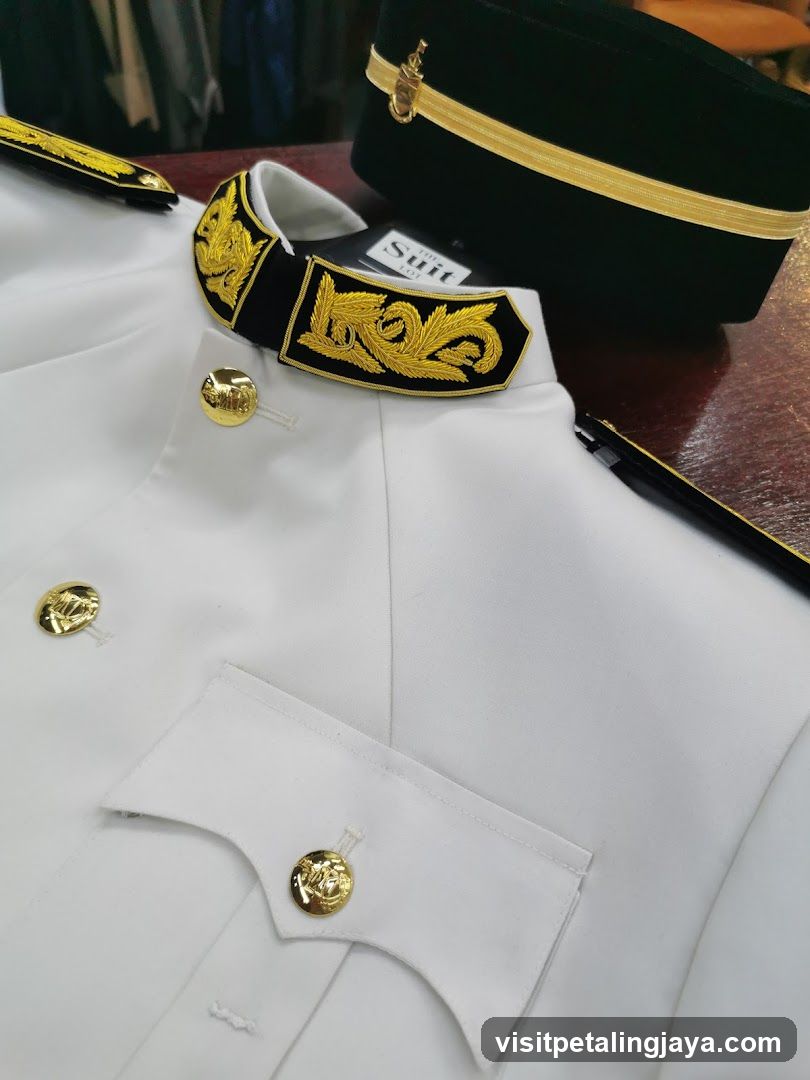 White Uniform with Gold Accents and Hat