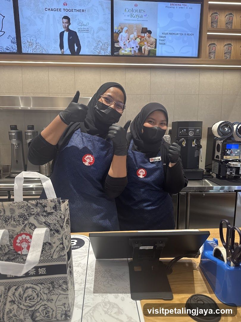 Tea Shop Staff Giving Thumbs Up