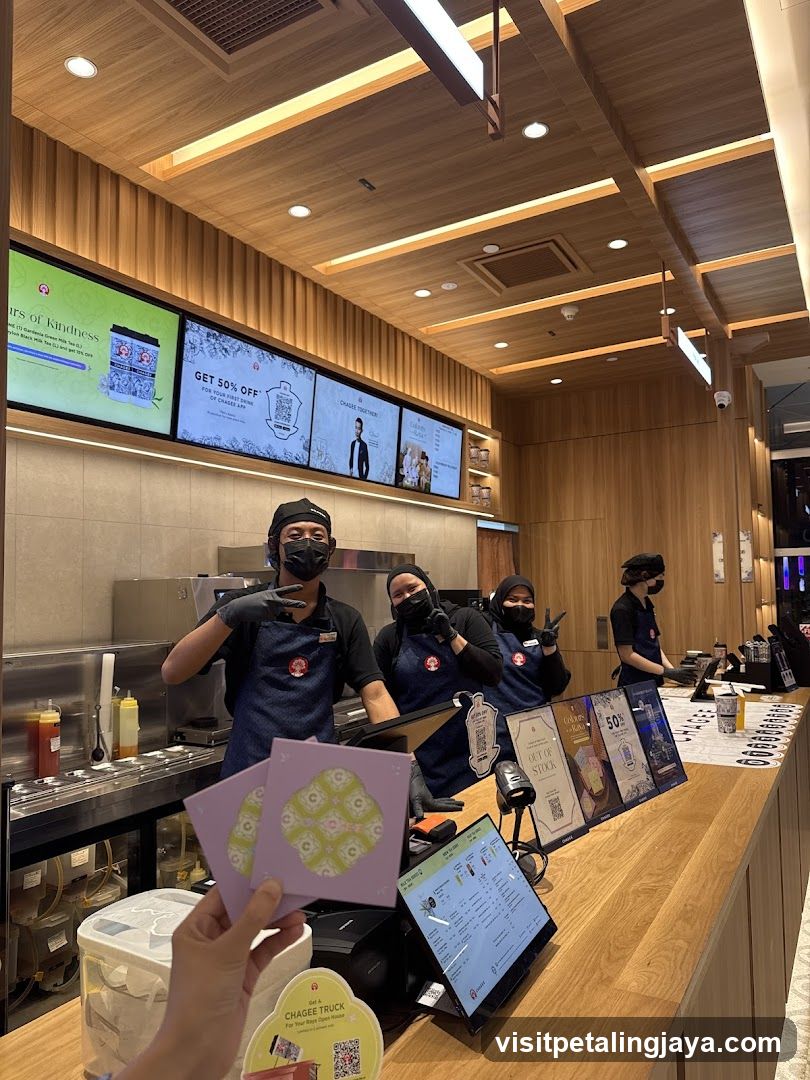 Coffee Shop Interior with Staff and Customer Interaction