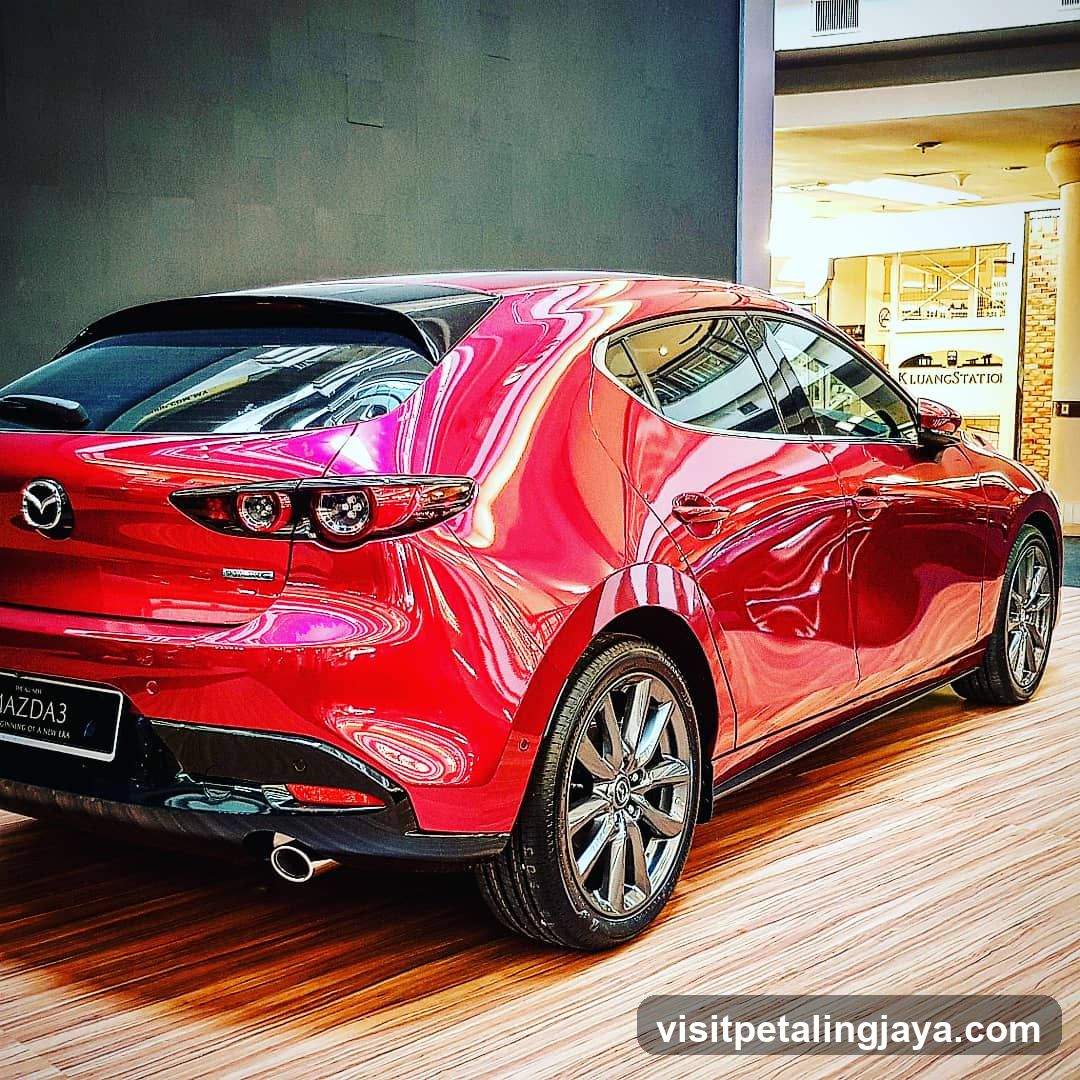 Red Mazda 3 in showroom