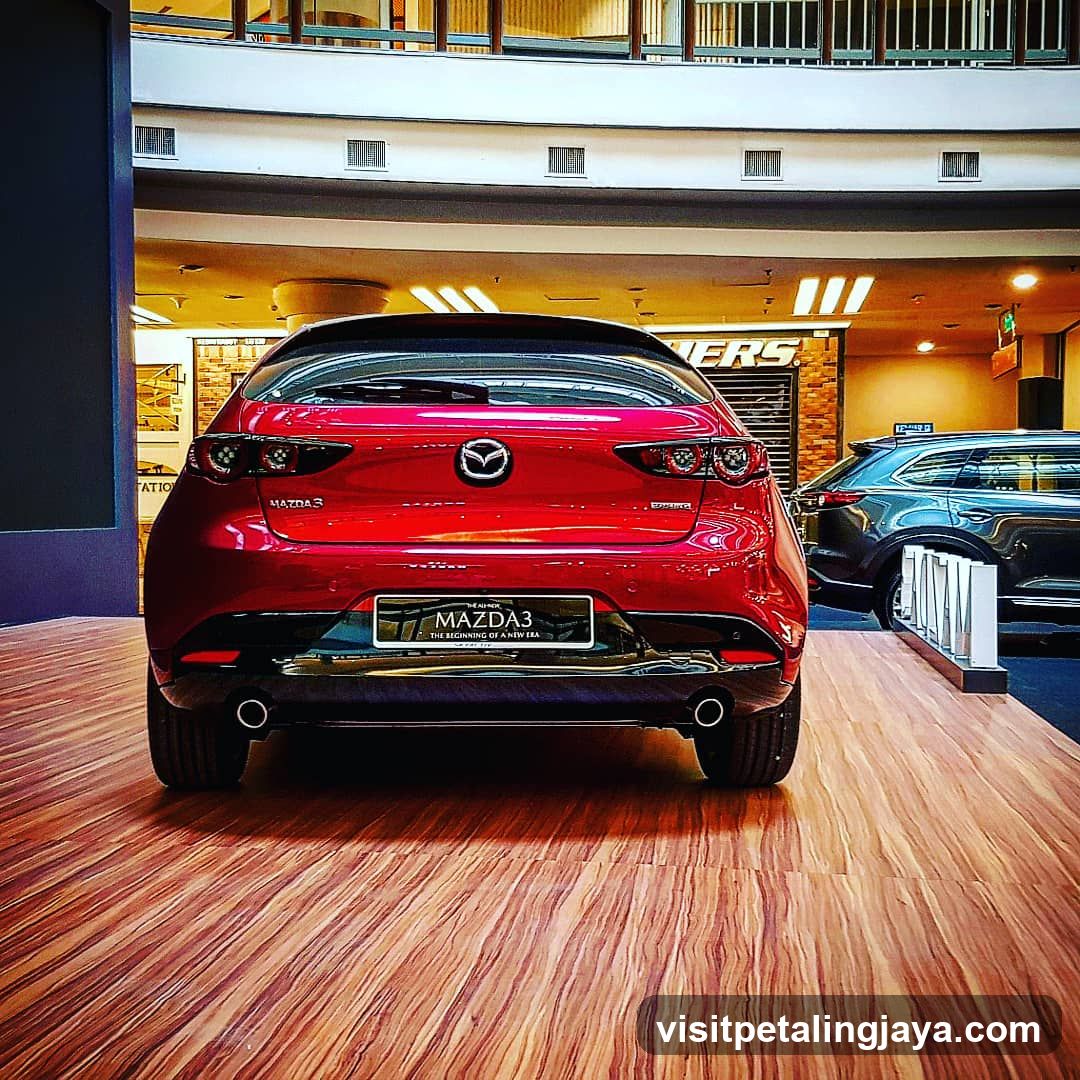 Red Mazda3 in showroom