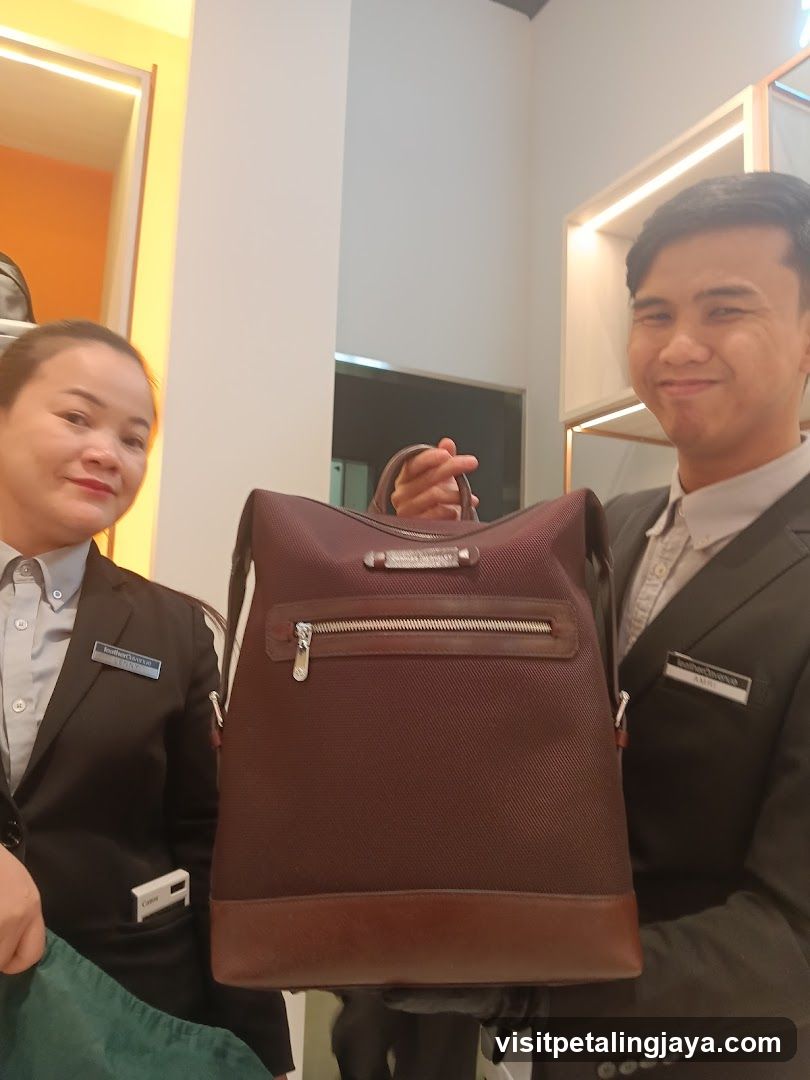 Staff Displaying Leather Bag