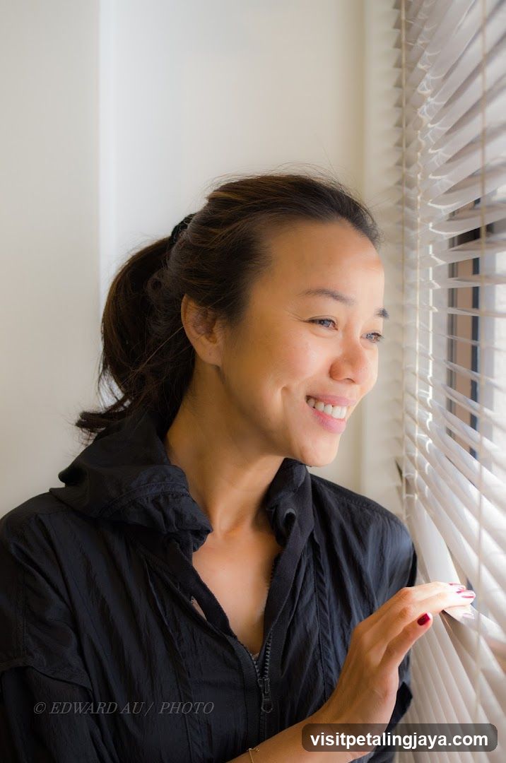 Woman Looking Out Window