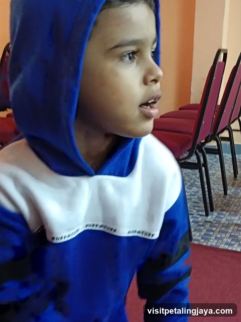 Boy in Blue Hoodie
