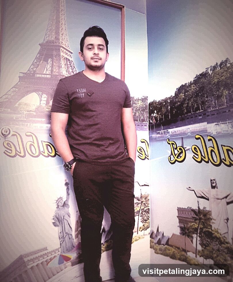 Man Standing in Front of Travel Posters