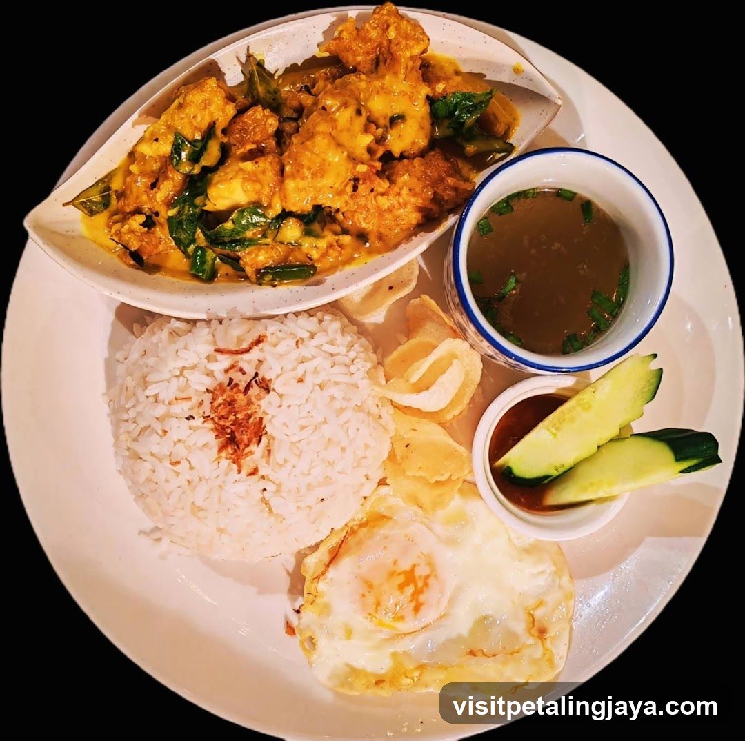 Curry Rice Plate with Fried Egg and Cucumber