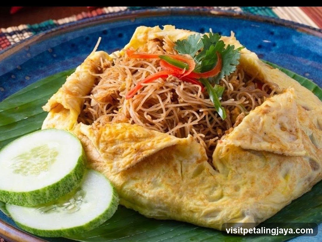 Egg-wrapped noodles with cucumber garnish