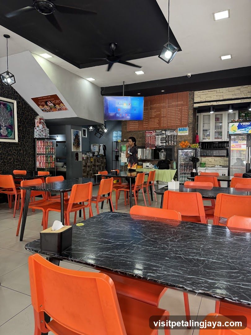 Restaurant Interior with Orange Chairs and Menu Board