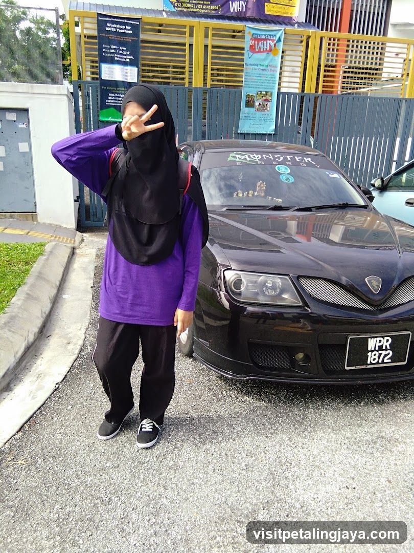 Person posing with car