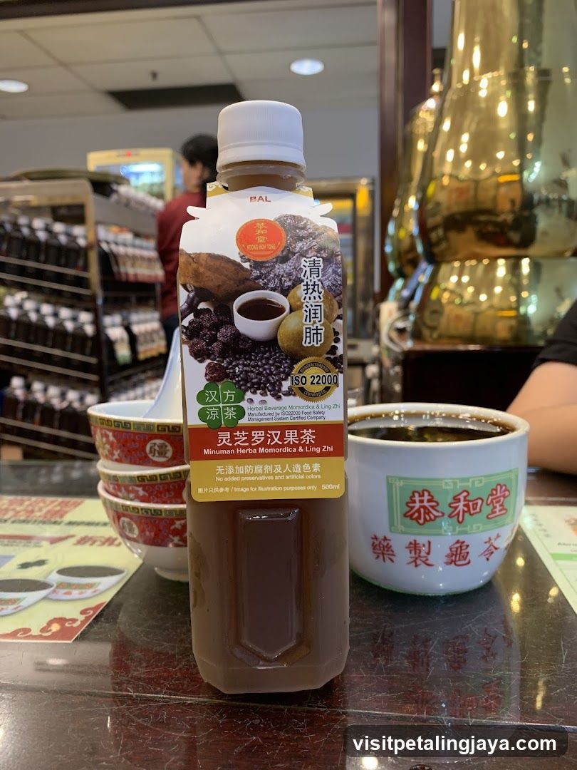 Bottled Tea and Cup on Table