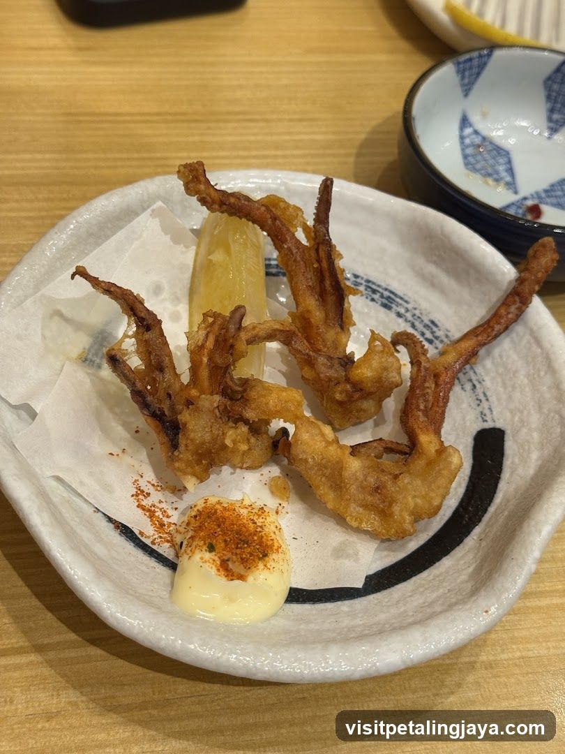Fried Squid with Sauce and Lemon Wedge