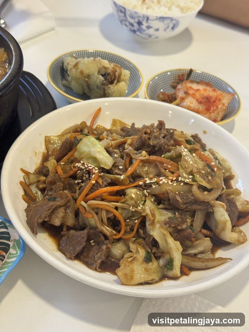 Korean-style stir-fry dish with side dishes