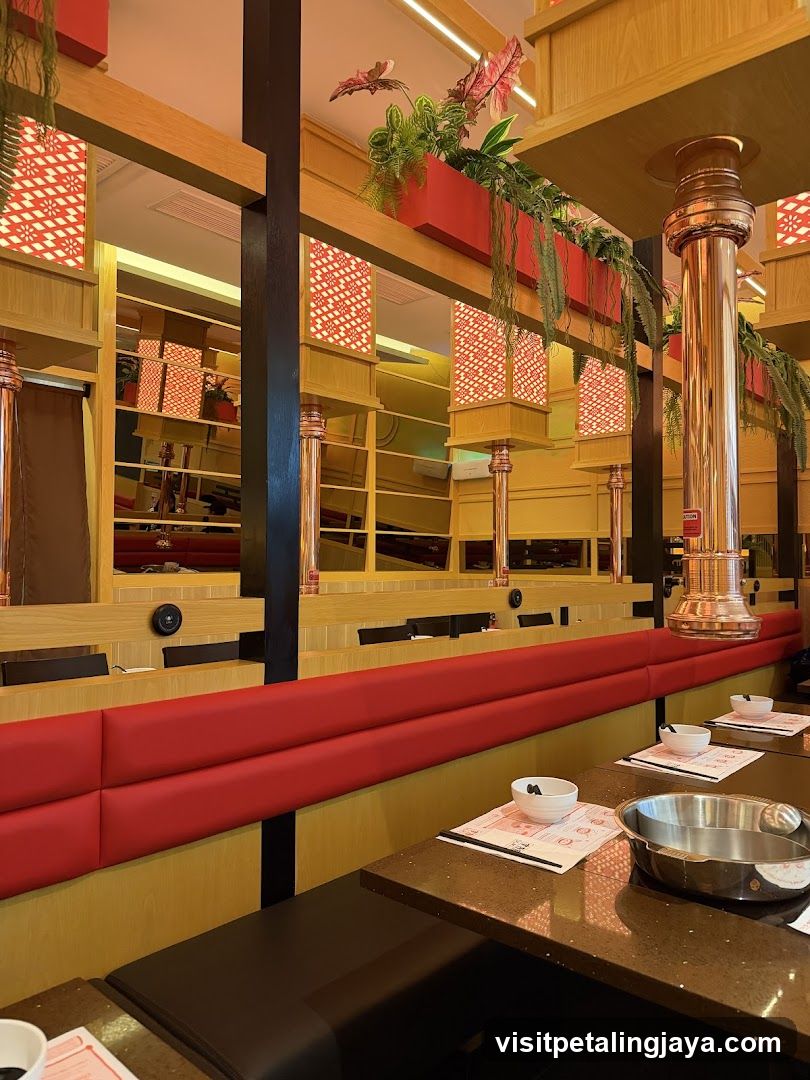 Restaurant Interior with Red Booths and Hanging Plants