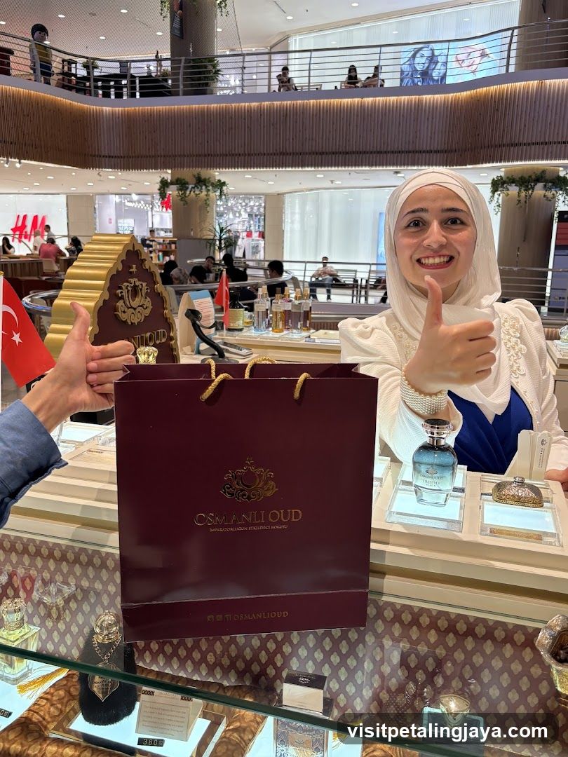 Shopping in a mall with Oud perfume display
