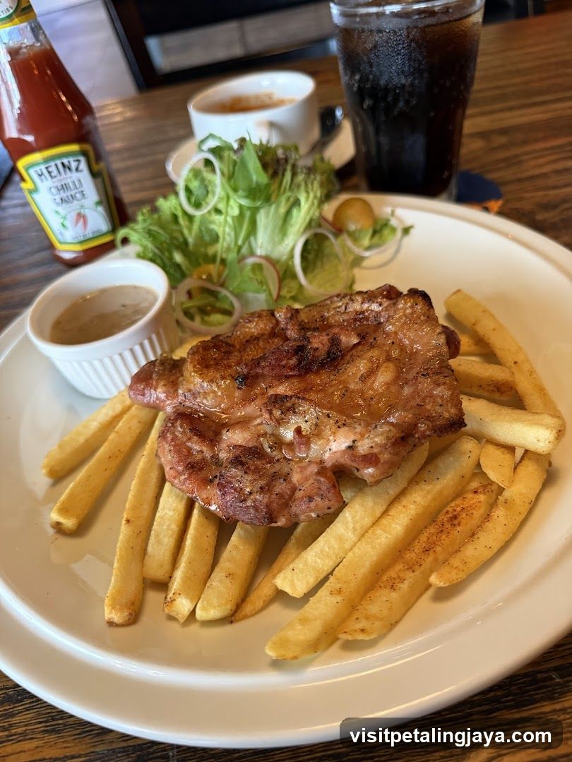 Grilled Pork Chop with Fries and Salad
