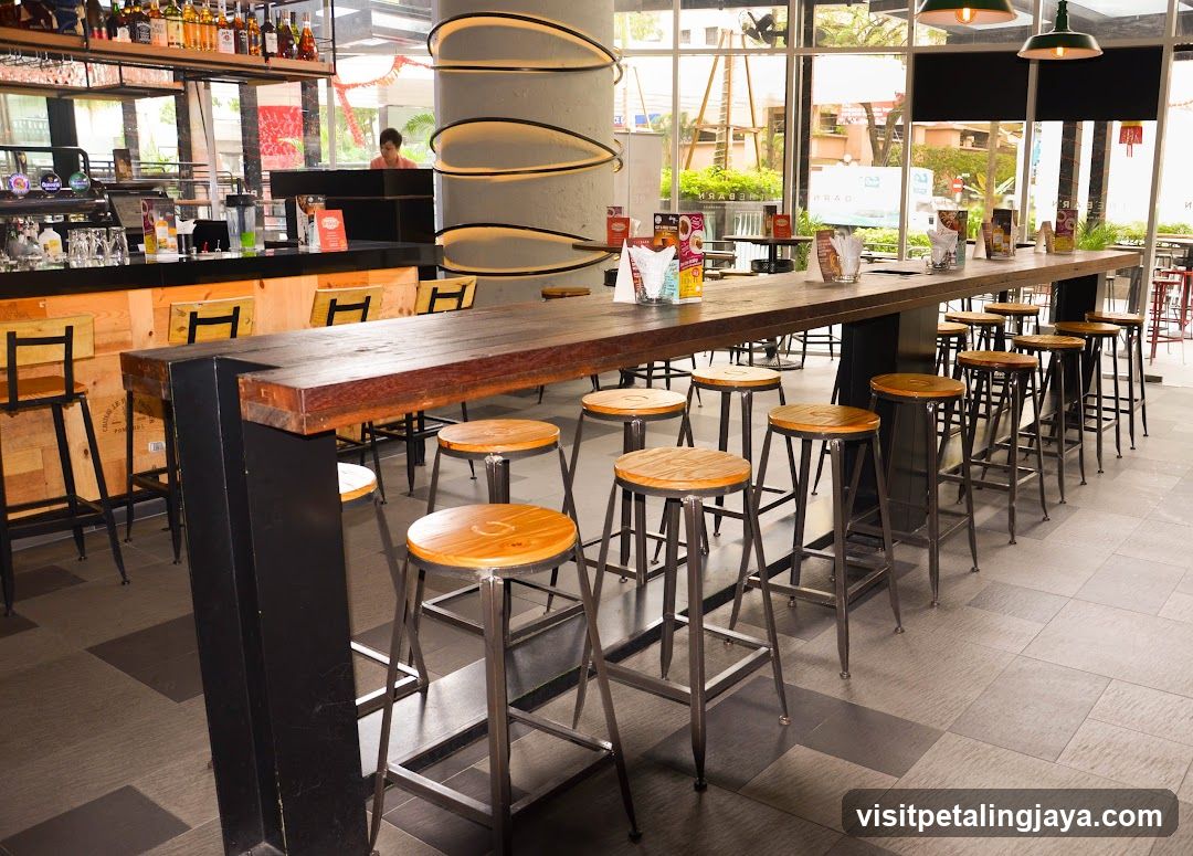 Bar Interior with High Tables and Stools