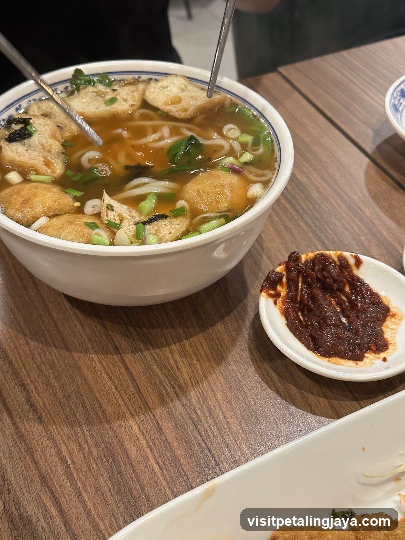 Bowl of Noodle Soup with Side Dipping Sauce