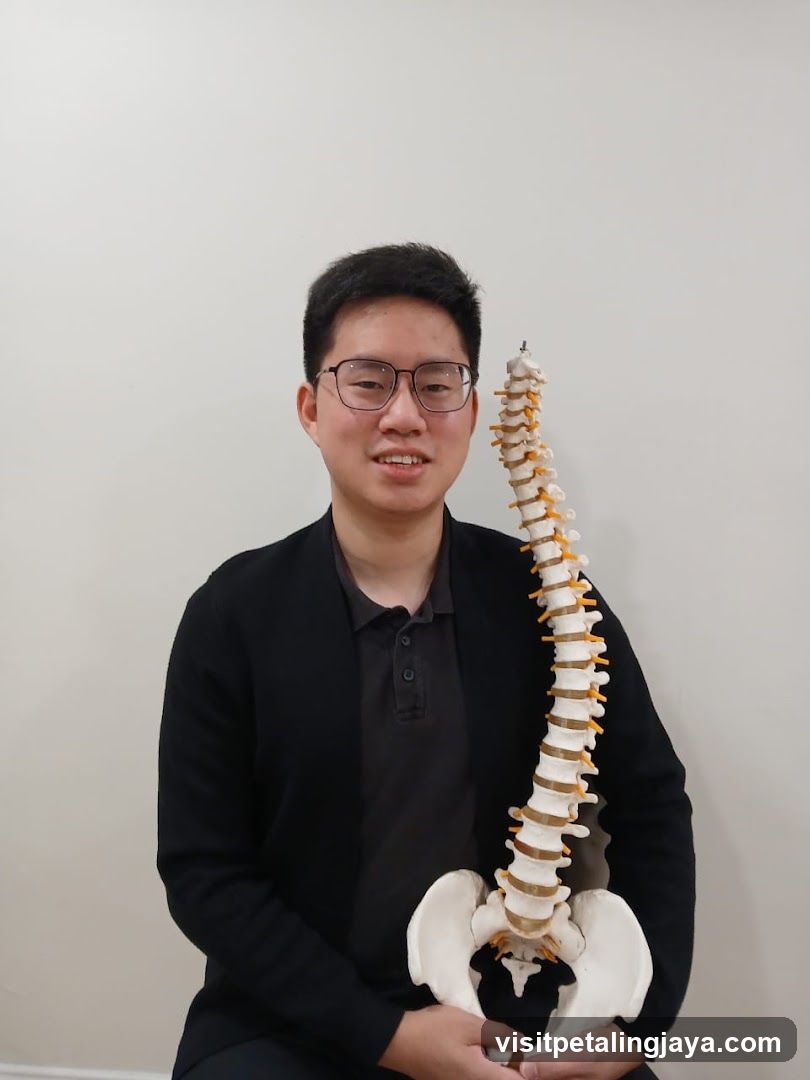 Person holding spine model