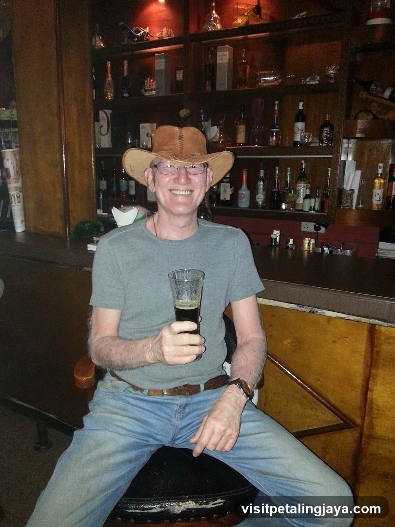 Man in Cowboy Hat at Bar