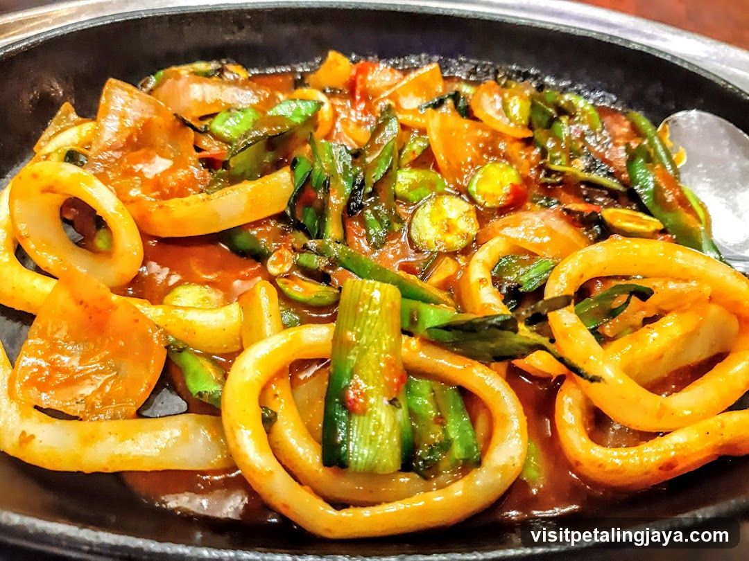 Sizzling Korean-style seafood dish in a clay pot