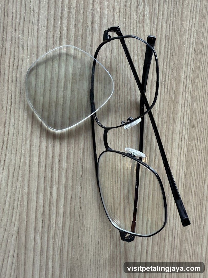 Eyeglasses and Lens on Wood Surface