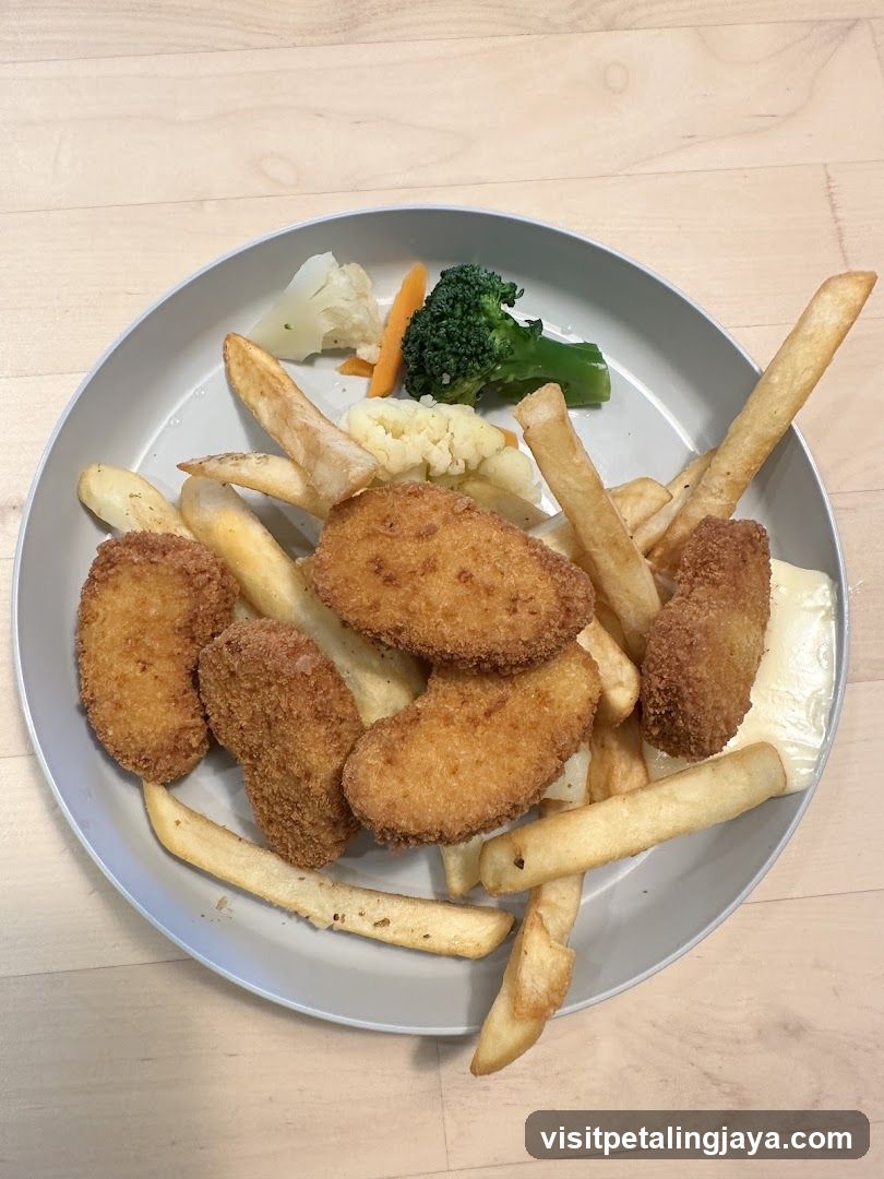 Fried Chicken and Fries with Vegetables