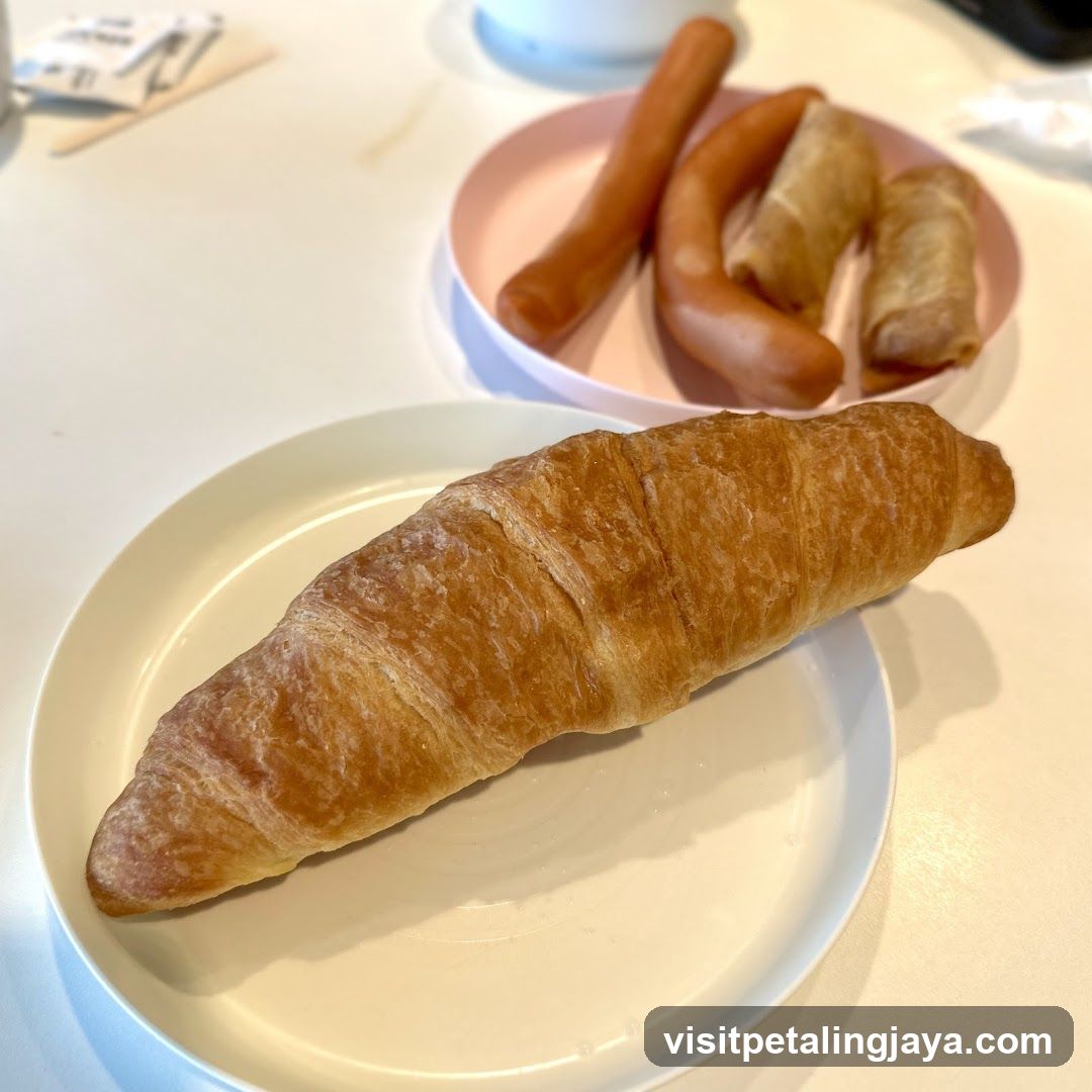 Croissant and Sausage Breakfast