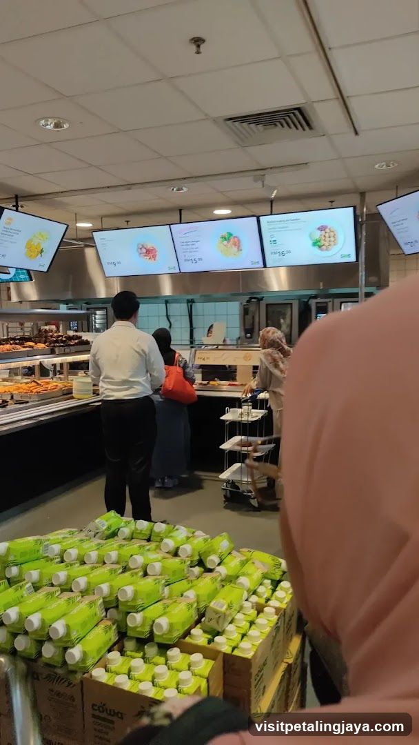 Grocery Store Interior with Food Display and Menu Screens